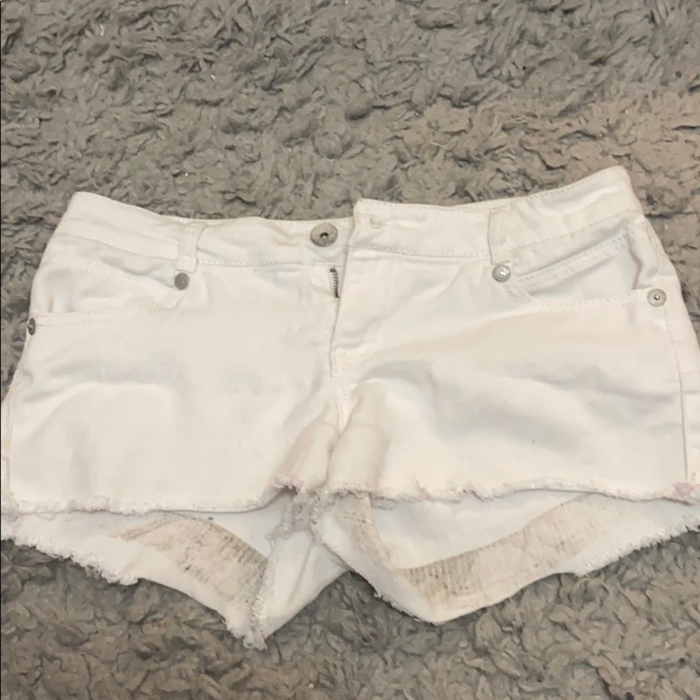 White ripped jean shorts